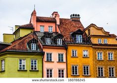 many different colored buildings with windows and roof tops in the old town, prague, czech