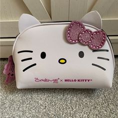 the hello kitty purse has pink sequins on it