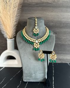 Rani green Drop Kundan back Meenakari Necklace set. Expertly crafted with Rani green Kundan and Meenakari work, this necklace set adds a touch of elegance to any outfit. Its intricate design and vibrant color make it a standout piece. Perfect for special occasions or as a statement accessory. Elegant Green Kundan Necklace With Meenakari, Elegant Green Zari Work Kundan Necklace, Green Meenakari Sets For Festivals, Green Kundan Temple Jewelry Set, Green Chandbali Jewelry For Diwali, Green Necklace For Diwali, Festive Green Meenakari Jewelry, Heavy Green Temple Necklace, Green Kundan Jewelry With Meenakari