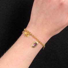 This 14k gold charm bracelet features 8 gemstone and enamel charms -- most were originally antique stickpins (circa 1910). Two of the charms are 10k gold, but the others are all 14k. The bracelet measures 7 inches long and weighs 7.9 grams. It is in good condition with some loss to the enamel on two of the flower charms and some replacement pearls on the opal charm. Materials: 14k gold, Enamel, Gemstones. Antique Charm Bracelet, Vintage Baptism, Jewelry Post, Gold Charm Bracelet, Diamond Flower, Antique Diamond, Enamel Charms, Gold Enamel, Flower Charm