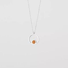 Pigment Necklace (Koa/Silver) | Holzkern Dainty Round Jewelry With Adjustable Length, Adjustable Circle Necklaces For Everyday, Everyday Adjustable Circular Necklaces, Adjustable Sterling Silver Round Charm Necklace, Adjustable Round Sterling Silver Charm Necklaces, Minimalist Sterling Silver Amber Jewelry, Minimalist Amber Sterling Silver Jewelry, Nickel-free White Gold Circular Jewelry, Modern Pendant Jewelry With Clavicle Chain