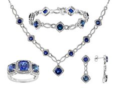 18.39ctw Square Cushion Lab Created Blue Sapphire And 0.02ctw Round White Diamond Rhodium Over Brass Necklace, Bracelet, Ring And Earring Jewelry Set. Necklace Measures Approximately 18"L x 0.99"W With Lobster Clasp Closure. Bracelet Measures Approximately 7.25" x 0.42"W With Box Clasp Closure And Safety Lock. Ring Measures Approximately 0.89"L x 0.44"W. Not Sizeable. Dangle Earrings Measure Approximately 1.25"L x 0.43"W With Pushbackings. Elegant Sapphire Jewelry With Hand Set, Elegant Sapphire And Diamond Jewelry Sets, Diamond White Cubic Zirconia Jewelry With Gemstone Accents, Dazzling Sapphire Jewelry For Formal Occasions, White Gold Jewelry With Gemstone Accents In Cubic Zirconia, Anniversary Diamond Gemstone Jewelry Sets, Elegant Hand-set Sapphire Jewelry, Elegant Hand Set Sapphire Jewelry, Classic Cubic Zirconia Jewelry With Gemstone Accents