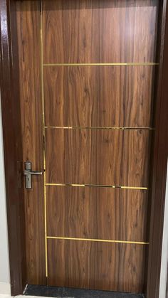 a wooden door with gold lines on it