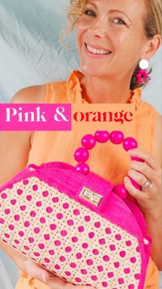 Model wearing an orange top and pink earrings and pink woven bag Affordable Pink Trendy Straw Bag, Trendy Pink Straw Bag Affordable, Luxury Pink Straw Bag With Braided Handles, Luxury Summer Bags With Branded Hardware, Luxury Pink Straw Shopping Bag, Luxury Bags With Round Handle For Spring, Woven Bags Boho, Pink Rattan, Resort Vacation Outfits