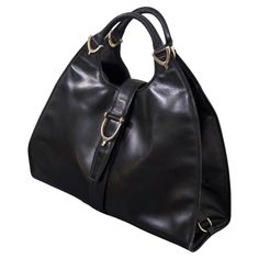 Gucci Vintage Black Leather Stirrup Hobo Handbag | From a unique collection of rare vintage Hobo Bags at https://www.1stdibs.com/fashion/handbags-purses-bags/shoulder-bags/hobo-bags/. Dome Bag, Trapezoid Shape, Leather Bag Design, Black Leather Bag, Gucci Vintage, Hobo Handbag, Handbags And Purses, Italian Craftsmanship, Black Leather Bags