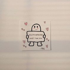 a piece of paper with an image of a robot holding a sign that says, you're amazing and i love you