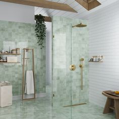 a bathroom with green tiles and white walls, including a walk in shower next to a wooden bench