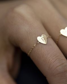 Dainty 14k gold Little Heart chain ring. Personalize this chain ring with up to 4 characters of your choice. Dainty light chain ring style, Perfect as a stacking ring or by itself. Mini heart charm measures approx. 6.5 X 7.5mm Dainty 14k Gold Personalized Initial Ring, Dainty 14k Gold Initial Ring Tarnish Resistant, Dainty Personalized 14k Gold Initial Ring, Dainty Sterling Silver Initial Ring Stamped 14k, Dainty Rose Gold Initial Ring, Tarnish Resistant, Dainty Rose Gold Initial Ring Tarnish Resistant, Dainty Rose Gold Initial Ring With Tarnish Resistance, Dainty 14k Gold-filled Promise Jewelry, Dainty 14k Gold Filled Promise Jewelry