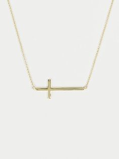 This delicate gold cross necklace is perfect for everyday wear! The dainty cross and chain make it easy to keep on and style with any outfit! Everyday Cross Charm Necklace With Clavicle Chain, Minimalist Cross Charm Necklace With Delicate Chain, Minimalist Charm Necklace With Cross Pendant And Adjustable Chain, Minimalist Charm Necklace With Cross Pendant, Minimalist Cross Necklace With Delicate Chain, Simple Everyday Cross Pendant Necklace, Simple Everyday Cross Necklace, Everyday Cross Necklace With Clavicle Chain, Gold Cross Necklace With Delicate Chain For Everyday