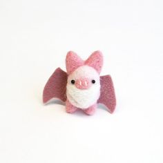 Fun and cute animal accessory. Woodland gift.Needle felted pink bat brooch. Miniature felt animal pin.Baby fuzz bats are very curious.They don't sleep and hide like the other bats do.Baby bats are looking for fun and want to stick with you wherever you go!This mini fuzz bat pin size is approximately H1.5"(3.8cm)  W2"(5cm)The bat is needle felted, the wing + pin are sewed on individually by me in U.S.A.*The one you will receive may not be the one in the pictures above. Since it is handmade, each Halloween Felt Crafts, Felt Woodland, Needle Felting Diy, Felt Halloween, Needle Felting Projects, The Wing, Miniature Animals, Needle Felted Animals, Animal Ornament