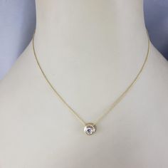 14 Karat Yellow Gold Diamond Solitaire Necklace-  This sparkling solitaire necklace features one round brilliant cut diamond set in classic 14K yellow gold.  Approximate total diamond weight:  .42 ct. - .50 ct.  Diamond clarity:  VS  Diamond color: G  Stamped: 14K  Size:  16 inches (necklace)            8 mm (pendant)  Weight:  1.7 dwt. / 8.2 gr.  *Stone weights are approximated and calculated by formula.  Very good condition, professionally polished.  Will come packaged in a gift box or pouch (when possible) and will be shipped U.S. Priority Mail Insured. Classic 14k Yellow Gold Solitaire Necklace, 14k Yellow Gold Solitaire Necklace For Formal Events, Formal 14k Yellow Gold Solitaire Necklace, Formal Fine Jewelry Yellow Gold Solitaire Necklace, Yellow Gold Solitaire Necklace For Formal Events, Gold 14k Diamond Necklace With Single Diamond, Classic Diamond Birthstone Necklace For Formal Occasions, Formal Yellow Gold Solitaire Necklace, Formal Classic Birthstone Necklace With Diamond Accents