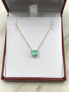 Featured here is a 1.32-carat stunning, Colombian emerald necklace in fine 14K yellow gold. Displayed in the center is a medium-light green emerald with incredible crystal clarity, accented by a simple four-prong gold mount, allowing for the emerald to be shown in full view. The earth mined, green Colombian emerald has a desirable lush green color with excellent qualities. An 18 inch is attached to the emerald pendant. This necklace is ideal for everyday use and is the perfect accessory to any o Fine Jewelry Green Diamond Cut Necklaces, Emerald Necklace With Diamond Cut In Fine Jewelry Style, Formal Cushion Cut Gemstone Necklace, Exquisite May Birthstone Necklaces For Formal Occasions, Exquisite May Birthstone Necklace For Formal Occasions, 14k Gold Emerald Cut Fine Jewelry Necklace, Formal Diamond Cut Necklace For May Birthstone, Green Diamond-cut 14k Gold Necklace, Luxury Cushion Cut Gemstone Necklace