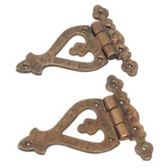 two antique style door handles with hearts and scrolls on the handle, one has a latch