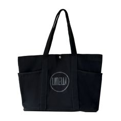 Be prepared for any adventure with our Can Hold It All Tote! This stylish and spacious tote has you covered, keeping everything you need in one place. Say goodbye to digging for your essentials and hello to convenience and organization. Perfect for the on-the-go lifestyle. Practical Weekender Tote Bag With Pockets, Large Capacity Black Canvas Bag For On-the-go, Black Canvas Bag With Removable Pouch For On-the-go, Versatile Black Canvas Bag For Daily Use, Large Bags With Pockets, Practical Black Travel Bag With Zipper Pocket, Large Everyday Bags With Pockets, Black Bags With Pockets For On-the-go, Functional Black Canvas Bag With Double Handle