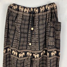 These Harem Pants Are From The Puppet Company Costume Collection. These Are The Pants To Wear Outside With Just A Little Thicker Fabric (Not Cotton Broadcloth). Features Elephants And Geometric Design In Gold On Black. A Great Halloween Costume. Size Large Waist: 28 -34" Hips: Up To 44" Length: 37" Inseam: 22" One Large Pocket For A Cell Phone And Drawstring With Elastic Waist. We Never Used These Pants So Condition Is Like New Except One Of The Wooden Beads Is Chipped. Sale Supports Vermo Bohemian Style Black Straight Pants, Black Pants With Pockets For Festival, Bohemian Black Bottoms For Festival, Black Trousers For Festival, Black Wide Leg Bottoms For Festival, Wide Leg Black Bottoms For Festival, Black Cotton Harem Bottoms, Black Harem Pants With Elastic Waistband For Festivals, Black Bohemian Bottoms For Festivals