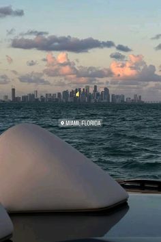 the miami skyline is seen from across the water