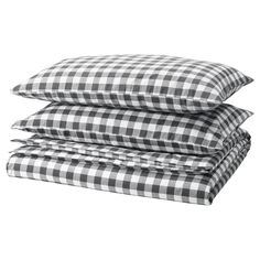 three black and white checkered sheets stacked on top of each other, one is folded up