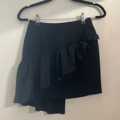 Black Mini Skirt With Ruffle From Intermix. Never Worn Before. Cute Silk Ruffle Goes Down It To The Back. Elegant Mini Skirt With Ruffles For Workwear, Elegant Ruffled Mini Skirt For Workwear, Chic Ruffled Bottoms For Formal Occasions, Chic Ruffled Skort For Party, Chic Formal Bottoms With Ruffles, Elegant Skirted Skort For Night Out, Chic Asymmetrical Ruffled Mini Skirt, Chic Skirted Skort For Night Out, Chic Ruffled Mini Skirt For Evening