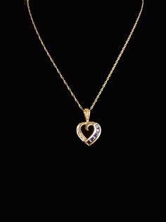 This gorgeous gemstone ( Sapphires and Diamond) petite heart necklace is brilliant and stunning Beautifully sculpted 10kt yellow gold heart setting holds the blue sapphires and one diamond. It hangs from a 10KT gold fine chain. 4-1-20 Sapphire Heart Cut Birthstone Jewelry, Heart Cut Sapphire Birthstone Jewelry, Formal Heart Cut Birthstone Necklace, Anniversary Gemstone Heart Pendant Necklace, Sapphire Heart Necklaces For Anniversary, Gemstone Heart Pendant Necklace For Anniversary, Sapphire Heart Necklace For Anniversary, Anniversary Heart Pendant Necklace With Gemstone, Heart-shaped Sapphire Necklace For Anniversary