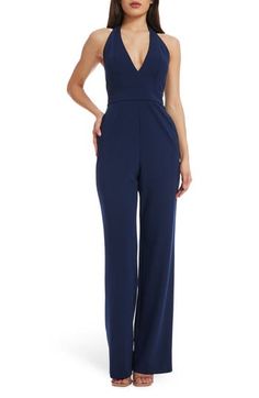 A plunging neckline draws attention to this stunning wide-leg jumpsuit with an open back and handy pockets. 48" length (size Small) Halter neck Adjustable tie straps 96% polyester, 4% spandex Machine wash, line dry Imported V-neck Party Jumpsuit With Tie Back, V-neck Tie Back Jumpsuit For Party, V-neck Jumpsuit With Tie Back For Party, Chic V-neck Jumpsuits And Rompers For Gala, Elegant V-neck Jumpsuit For Date Night, Elegant Floor-length Strapless Jumpsuit For Formal Occasions, Elegant Evening Strapless Maxi Jumpsuit, Formal Strapless Backless Fitted Jumpsuit, Formal Fitted Strapless Backless Jumpsuit