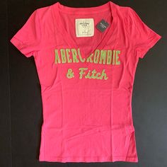 Abercrombie & Fitch Vintage Embroidered V Neck T-Shirt Brand New With Tags, Never Worn 100% Cotton Fitted Casual Tops With Embroidered Logo, Pink Crew Neck Top With Embroidered Logo, Pink Relaxed Fit Top With Embroidered Logo, Embroidered Logo Tops For Summer, Pink Embroidered T-shirt, Casual Embroidered Pink Top, Casual Pink Embroidered Tops, Pink Embroidered Casual T-shirt, Pink Embroidered Short Sleeve Top