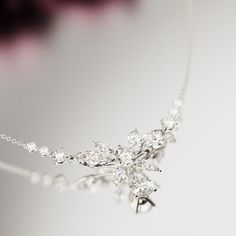 Introducing Blossom: Crafted as a romantic high-end floral necklace to complement any of our other pieces as a set or to shine brightly on it's own. This classical necklace is perfect for any occassion. As a gift for her, a supplement to an engagement ring or a gift for yourself - because you deserve it - it is guaranteed to impress. A bright and shiny string of simulated diamonds make this necklace stand out and is sure to bring lots of compliments. Each stone shines brightly to perfection and Exquisite Wedding Necklace With Clavicle Chain, Formal Flower Pendant Necklace For Mother's Day, Mother's Day Party Sterling Silver Necklace, Wedding Jewelry With Cubic Zirconia Flower Pendant, Delicate Cubic Zirconia Necklace For Mother's Day, Fine Jewelry Bridal Necklace, Elegant Flower Shaped Cubic Zirconia Necklace, Elegant Flower-shaped Wedding Jewelry, Elegant Flower Shaped Wedding Jewelry