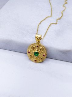 Constantine Solid Gold Coin Pendant with Emerald and Ruby. A Byzantine Handmade ICXC NIKA Charm from 14k Yellow Solid Gol  with Natural precious stone - set with a central Emerald stone of 0.28carats and diameter 4.15mm and 4 Ruby. An ideal choice for a NewBorn Babies protection gift or as a baptismal gift. But also as a special and unique piece of jewelry that you can wear every day.   Details: Charm Size: diametre 18mm Weight: 14k 4.8gr Metal: 14k Yellow Gold Gem Stone: Emerald 0.28ct ❣️ For more  Constatine charm take a look here      👉  https://www.etsy.com/shop/GiorgosJewelry?ref=seller-platform-mcnav&section_id=23772595 🎁 All of our jewelry come in specially hand packaged gift boxes        so they are ready for great gift giving! 📞 Please fill in your order a mobile phone number f Handmade Byzantine Necklace For Ceremonial Use, Handmade Byzantine Ceremonial Necklace, Handmade Byzantine Style Ceremonial Necklace, Handmade Green Byzantine Jewelry, Handmade Byzantine Round Necklace, Handmade Byzantine Style Necklace, Gold Coin Jewelry, Emerald Style, Baby Protection