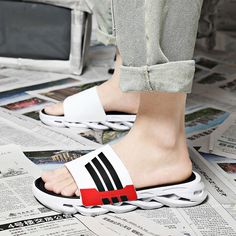 Slide through your day with our comfy - wear as you go - sliders. It's sole made of PVC and rubber gives a perfect mix of durability with softness. State your style with our sophisticated slippers to go along with your vibe! Casual Synthetic Slide Slip-ons, Casual Outdoor Slip-on Slides, Non-slip Eva Slide Slippers, Comfortable Non-slip Slides For Leisure, Comfortable Slip-on Slides For Leisure, Slip-on Eva Slippers With Textured Footbed, Slip-on Slippers With Textured Footbed, Comfortable Non-slip White Sandals, Comfortable White Slip-on Slides