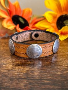 Navajo Made Leather  Sterling Silver Coin Bracelet. It measures 3/4 of an inch wide and 9 3/8 inches long.   Thank you for checking out my store, if you have any questions please contact me!!    Exported By ExportYourStore :) SKU:465806885522_7D9C* Southwestern Style Brown Concho Bracelets, Southwestern Hand-tooled Brown Bracelets, Vintage Adjustable Leather Bracelet With Concho, Western Concho Bracelets For Festival, Brown Hand Tooled Western Bracelets, Western Style Concho Bracelets For Festivals, Rustic Hand Tooled Festival Bracelets, Adjustable Southwestern Hand-tooled Bracelets, Rustic Adjustable Stamped Cuff Bracelet