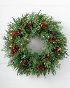 Deck the halls with charming lifelike greenery to create a natural, cozy look. Hang on doorways or above the mantel for a timeless touch to your holiday home. | Outdoor Winter Evergreen Wreath Christmas Wreaths With Lights, Pre Lit Wreath, Christmas Wreaths & Garlands, Artificial Christmas Garland, Artificial Christmas Wreaths, Evergreen Wreath, Outdoor Wreaths, Wreaths And Garlands, Christmas Ornament Sets