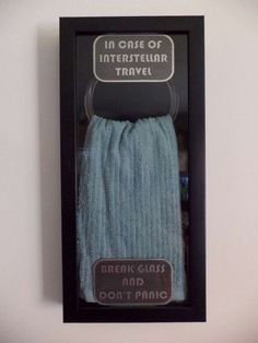 a pair of blue socks in a black box