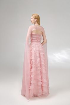 This set is expertly crafted with high-quality organza fabric, providing a luxurious feel and elegant drape. With its flowing layers and intricate ruffle details, this set is sure to make a statement at any special occasion. Elevate your style and grace with this timeless piece. *Product length is measured from the shoulder to the hem. Pre-draped Organza Evening Gown, Luxury Ruffled Prom Gown, Luxury Organza Party Gown, Luxury Organza Ball Gown, Organza Ruffled Evening Dress For Gala, Organza Evening Dress With Ruffles For Gala, Pre-draped Organza Evening Dress For Wedding, Formal Organza Evening Dress With Ruffles, Gala Evening Dress With Ruffles In Organza