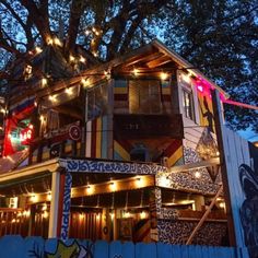 a colorful house with lights on the roof