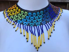 Beautiful Chaquira beads necklace. 100% handmade in Mexico by Huichol artisans. 📲Feel free to contact us with any questions you may have!  🛍More styles and other handmade items in our Etsy shop: https://www.etsy.com/shop/mexitlii 🇲🇽Hablamos Español. Artisan Dangling Beads For Crafting, Artisan Beaded Necklaces With Dangling Round Beads, Artisan Handmade Choker With Round Beads, Artisan Handmade Round Beads Choker, Festival Choker With Polished Round Beads, Unique Beaded Necklaces With Tiny Beads For Festivals, Unique Beaded Necklace With Tiny Beads For Festivals, Unique Handmade Choker With Round Beads, Unique Tiny Beads Necklace For Festival