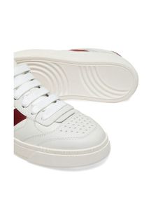 Step up your sneaker game with these white and red calf leather sneakers featuring a logo-debossed tongue, round toe, and branded leather insole. The perfect combination of style and comfort for any casual look. White and red calf leather Logo-print to the side Front lace-up fastening Flat rubber sole Red Color Combo, Sleek Logo, Detailing Logo, Hermes Birkin 25, Versace Bags, Birkin 25, Red Sneakers, Sneaker Games, Balenciaga Designer