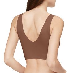 With a seamless finish and flexible fit, this invisibles lightly lined Calvin Klein bralette is crafted from smooth microfiber stretch. Designed with a v-neckline front and back, removable pads for added versatility, compact logo detailing and clean cut edges for invisible wear under clothing.Details: Lightly lined v-neck bralette Seamless elastic waistband Lightly lined bralette silhouette Smooth, flexible microfiber Clean cut edges, invisible under clothing V-neck, removable pads & logo at hem Calvin Klein Bralette, Clothing Details, Pajama Robe, Sleepwear Robe, Clean Cut, Pajama Shorts, Pant Shirt, Short Tops, Kid Shoes