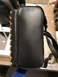 Michael Kors Women's Abbey Medium Studded Leather Backpack Black 35T8GAYB2L Pebbled leather with studded accent 100% polyester lining Gold tone hardware Zip closure Exterior features 1 zip pocket in front and 2 slide pockets on side Interior features 1 zip pocket, 1 large slip pocket and 2 multi-function slip pockets 23cm (W) x 30cm (H) x 11cm (D) Designer Leather Shoulder Backpack, Designer Leather Backpack With Branded Hardware, Luxury Leather Bags With Rivets, Designer Everyday Bags With Rivets, Michael Kors Leather Backpack With Zipper, Designer Leather Backpack With Gold-tone Hardware, Luxury Backpack With Gold-tone Hardware For Everyday Use, Designer Leather Bags With Rivets, Luxury Leather Backpack With Branded Hardware