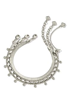 The Kassie Set of 3 Chain Bracelet in Silver features three classic chain links. Complete with a herringbone, paperclip, and crystal charm chain, wear altogether or curate your own bracelet stack. Bracelet In Silver, Brass Bangle, Charm Chain, Chain Bracelets, Chain Links, Silver Chain Bracelet, Gold Bracelet Chain, Crystal Charm, Gold Fashion