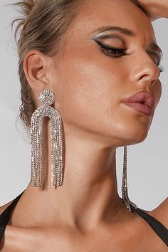 Enhance your elegance with the gemstone-studded Geometric U Jellyfish Inspired Tassel Earrings, a glamorous accessory that effortlessly adds sophistication to your outfit. Featuring intricate geometric patterns and graceful tassel detailing, these earrings will enhance your glamour and appeal. Whether you're attending a chic beach party, a stylish cocktail party, or any special occasion that calls for a unique and alluring accessory, these earrings are the perfect choice. Trendy Crystal Earrings For Evening, Trendy Evening Crystal Earrings, Silver Tassel Earrings With Rhinestone Fringe, Silver Crystal Dangle Tassel Earrings, Glamorous Crystal Dangle Tassel Earrings, Glamorous Rhinestone Tassel Earrings, Silver Rhinestone Fringe Tassel Earrings For Party, Glamorous Metal Tassel Earrings For Party, Elegant Silver Tassel Earrings For Party