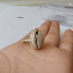 Natural Money Cowrie Sea shell ring, handmade ring, gift ring, Natural Sea shell ring, boho ring, women's ring, statement ring, Gift For Her Benefits Of Gemstone : It brings good luck, wealth, prosperity, fame and the power of destiny. Cowry shells are used in some religious or auspicious ceremonies too, like in Laxmi puja Kaudi shells are kept to please Goddess Laxmi and be blessed by Her and Lord Vishnu Those who have these cowries with them during prayer gets the blessing for both Lord Shiva and Goddess Lakshmi and they gain success, prosperity, wealth and fame in life. Cowries are also used as a tool to save children from evil and negativity. Thanks For Visiting My Shop. Bhagirath Unique Shell Jewelry For Gifts, Unique Shell Jewelry Gift, Silver Shell-shaped Ring For Gift, Handmade Shell Jewelry As A Gift, Silver Shell Rings For Beach, Silver Shell Rings For Gift, Unique Shell Jewelry As A Gift, Unique Shell Jewelry For Gift, Unique Shell-shaped Jewelry For Gift