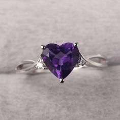 ◆ The ring is handcrafted from sterling silver and decorated with a dazzling 8*8 mm amethyst and CZs. It is suitable for engagement/anniversary/daily occasion. ◆ Production Description: Main stone Type: Natural Amethyst Main Stone Shape: Heart Cut Main Stone Size: 8*8 mm(1.78ct) Side stone: CZ Metal: 925 Sterling silver - Other options available in the drop down menu ◆ Customization: √Free for Add Engraving √Other Metal Type Available √Other Gemstones & Shapes Available √Personalization Requests Purple Diamond Ring With Diamond Accents For Anniversary, Purple Diamond Ring With Accents For Anniversary, Purple Heart Ring With Accent Stones For Anniversary, Anniversary Purple Heart Ring With Accent Stones, Sterling Silver Purple Birthstone Ring With Center Stone, Purple Sterling Silver Birthstone Ring With Center Stone, Purple Cubic Zirconia Birthstone Ring Gift, Amethyst Heart Cut Ring For Anniversary, Elegant Silver Amethyst Ring For Valentine's Day