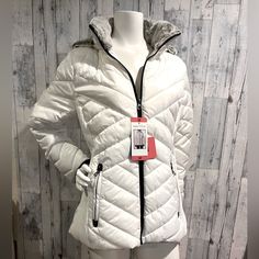 Brand New With Tags Nautica Quilted Jacket. It Has The Softest Faux Grey Fur Lined Detachable Hood. Front Zipper Pockets. It Has Black Knit Cuffs With Thumb Holes. The Side Has A Stretch Panel ( See Pic) Size Medium Shoulder To Hem In Front 26” Sleeve Length Including Cuffs Aprox 25” Pit To Pit In Front 21” Excellent New Condition White Weatherproof Winter Outerwear, Winter Weatherproof White Outerwear, White Casual Outerwear With Faux Fur Trim, Casual White Outerwear With Faux Fur Trim, White Weatherproof Long Sleeve Outerwear, White Weatherproof Fall Outerwear, Casual White Weatherproof Outerwear, White Fitted Outdoor Outerwear, Fitted White Outerwear For Outdoor