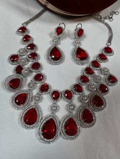 color red.Usually same day shipping available if order before 2 pm Eastern time. Guaranted shipped in 1-2 days. Luxury Red Necklace For Gift, Red Round Jewelry For Valentine's Day, Red Ruby Gemstone Necklaces, Red Ruby Gemstone Necklace, Luxury Red Jewelry For Valentine's Day, Luxury Red Necklaces For Formal Occasions, Red Ruby Jewelry Sets As Gift, Red Ruby Jewelry Sets For Gifts, Red Ruby Jewelry Sets For Party