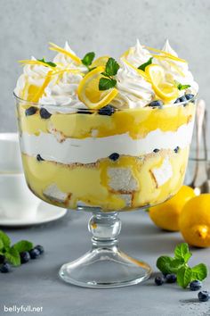 a trifle with lemons, blueberries and whipped cream