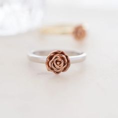 a rose ring sitting on top of a table