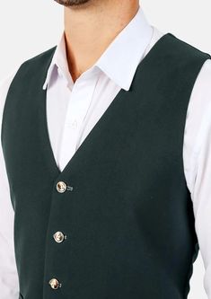 This Emerald Green Vest is designed with stretch cotton for comfort, and features a stylish deep green hue that stands out in a sea of blues without being over the top. One of our crowd favorites, this is a great choice to add to your wardrobe. Green Winter Workwear Vest, Winter Workwear Green Vest, Classic Green Vest For Winter, Classic Green Winter Vest, Green Fitted Classic Vest, Classic Green Cotton Outerwear, Fitted Green Cotton Outerwear, Formal Cotton Vest For Fall, Tailored Cotton Vest For Fall