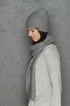 "THE SET of the GRAY snood and cap - warm, soft merino wool garment. Luxury and exclusive accessory. Snood and cap are made of very luxury merino wool yarn, thats why it's very soft. This garment is suitable even for the alergic people. Because of the knitting print, this cap will fit both - small and big headed people. It doesn't loses form wearing it. Composition - 70% merino wool, 30% alpaca wool. Dimensions: Scarf - Width- 30 cm / 11,81\", length - 185 cm/ 72,83\". Cap - Width- 42 cm/ 16,54\ Cozy Merino Wool Scarves For Winter, Casual Merino Wool Scarf For Winter, Soft Knit Beanie For Winter Gift, Soft Knit Winter Beanie As Gift, Winter Soft Knit Beanie Gift, Knitted Winter Scarves As Gift, Winter Gift Soft Knit Beanie, Winter Wool Knitted Scarves, Hand Knitted Wool Scarves For Winter