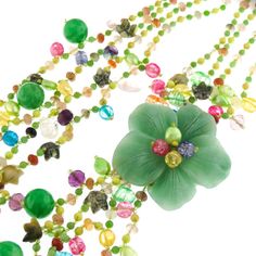 "Green Oasis Flower Gemstone 925 Sterling Silver Art Necklace Pictures cannot do justice to the rich opulence of this necklace. The centerpiece is a stunning flower cut out of solid aventurine. The necklace strap is richly beaded composition of cultured pearls and gemstones. Finished with 925 sterling. This necklace is a work of art. Pendant Size: 2 1/2\" flower Gemstone Type: Aventurine, carnelian, crystal Lock Type: Hook, 925 silver Necklace Size: 30\" Necklace Weight: ~11oz Price: 76.95" Elegant Flower Shaped Jade Jewelry, Green Gemstone Flower Pendant Jewelry, Green Beaded Flower Pendant Jewelry, Elegant Green Beaded Flower Necklace, Green Gemstone Flower Pendant Necklace, Green Gemstone Flower Pendant Necklaces, Green Gemstone Flower-shaped Jewelry, Green Gemstone Flower Shaped Jewelry, Green Pendant Necklace With Flower Charm