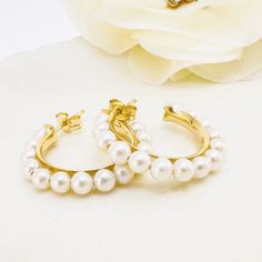 "These beautiful earrings have a hoop design that is accentuated by genuine pearls. There are 28pcs of genuine, white, round, cultured pearls measuring 3.5mm which are permanently wired onto a gold hoop-channel frame. These earrings measure 0.14\"x0.92\" and weighs 2.65 grams; the quality mark is on the posts and friction-backs.  Brand new earrings.  These earrings will ship in a jewelry gift box.  Thank you for looking and please visit my store panamericangem1 for more great jewelry listings    Exported By ExportYourStore :) SKU:1452*" New Earrings, Hoop Design, Earrings Metal, Pearl Hoop Earrings, Gold Hoop, Jewelry Gift Box, Cultured Pearls, Beautiful Earrings, Jewelry Earrings Dangle