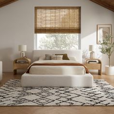 a bedroom with white furniture and bamboo shades on the window sill above the bed